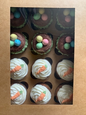 Carrot cake and Easter nest cupcakes with candy eggs